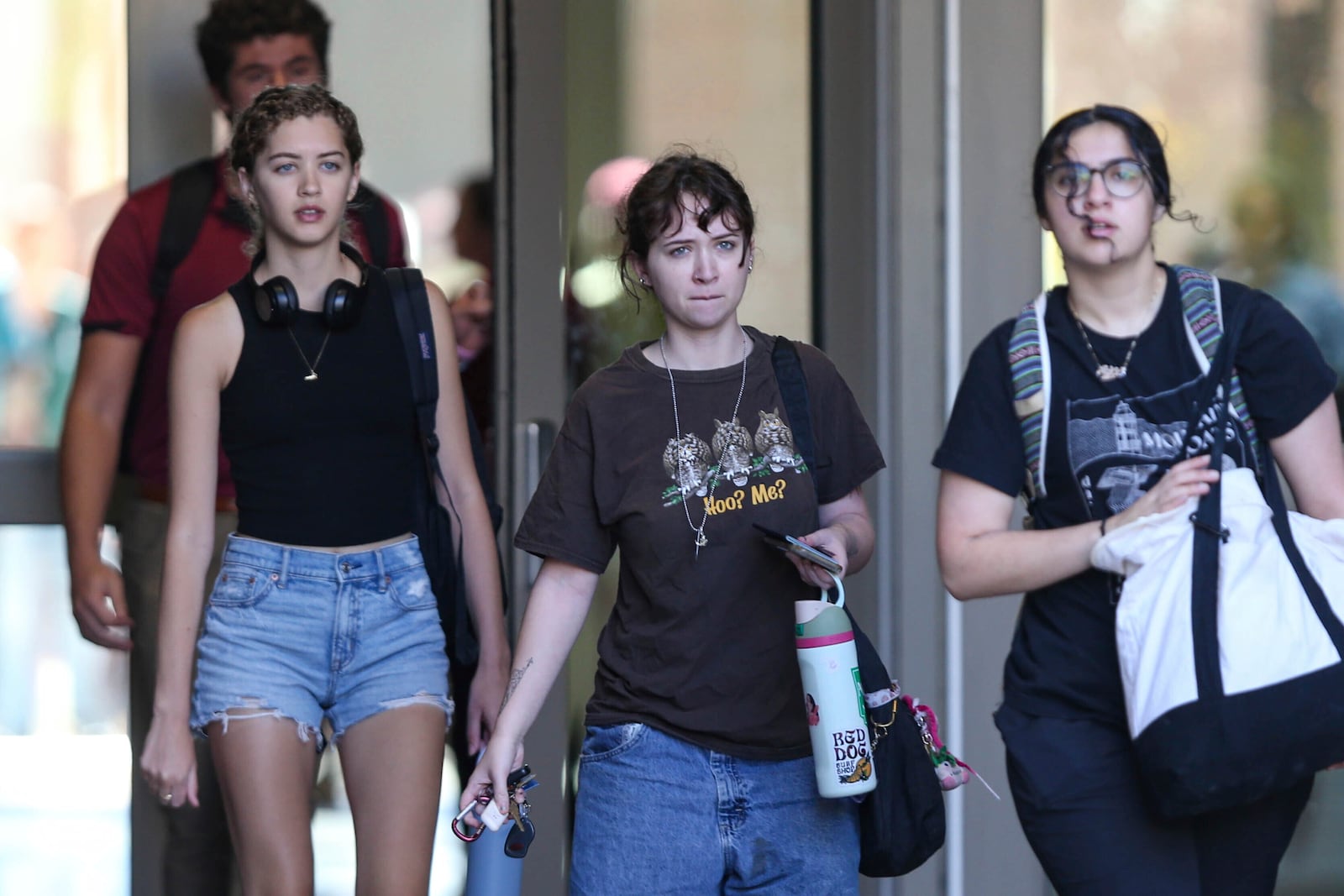 Students leave after retrieving their personal items from the Florida State Student Union, Tallahassee, Fla., Friday, April 18, 2025. (AP Photo/Gary McCullough)