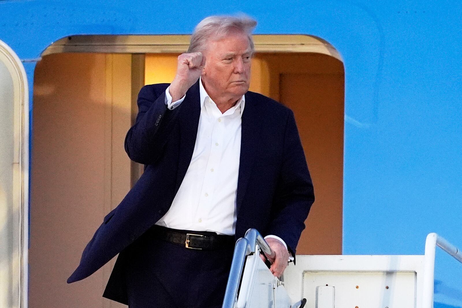 President Donald Trump arrives at Palm Beach International Airport, Friday, April 11, 2025, in West Palm Beach, Fla. (AP Photo/Manuel Balce Ceneta)
