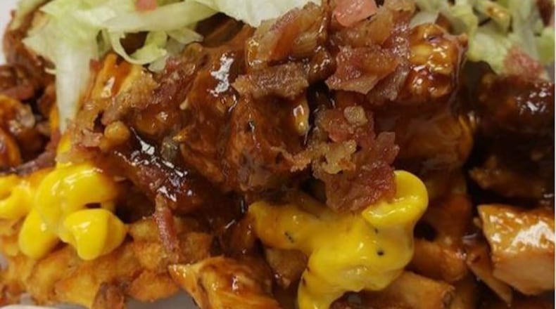 The Chicken Spot’s loaded fries comes with a choice of ‘sloppy topping’s that can includes choice of two sauces, chopped chicken tenders, crispy bacon, shredded romaine lettuce, chopped tomatoes and pickled onions. Mac and cheese or greens can be added for $2 each.
