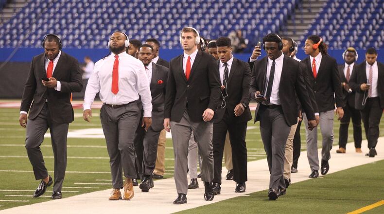 Ohio State’s defensive linemen arrive at Lucas Oil Stadium on Dec. 2, 2017, before a game against Wisconsin in Indianapolis. David Jablonski/Staff