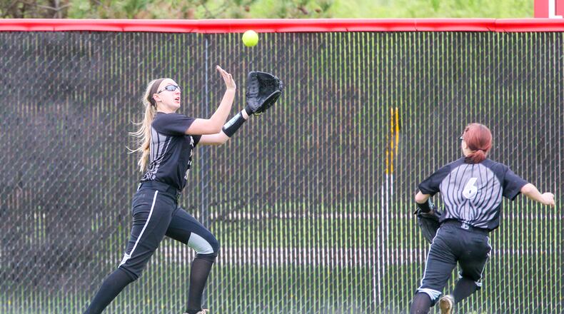 Lakota East center fielder Regan Butikofer (23) tracks down a fly ball during their game at Lakota West, Tuesday, Apr. 11, 2017. GREG LYNCH / STAFF