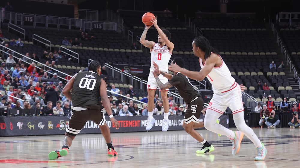 Dayton's Javon Bennett makes a 3-pointer in the first half against St. Bonaventure in the quarterfinals of the Atlantic 10 Conference tournament on Friday, March 13, 2026, at PPG Paints Arena in Pittsburgh. David Jablonski/Staff