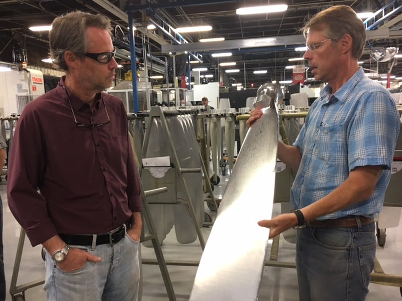 Former Hartzell Propeller owners James Brown, left, and his younger brother Joseph Brown, with an example of the company’s handiwork in a 2017 photo. THOMAS GNAU/STAFF