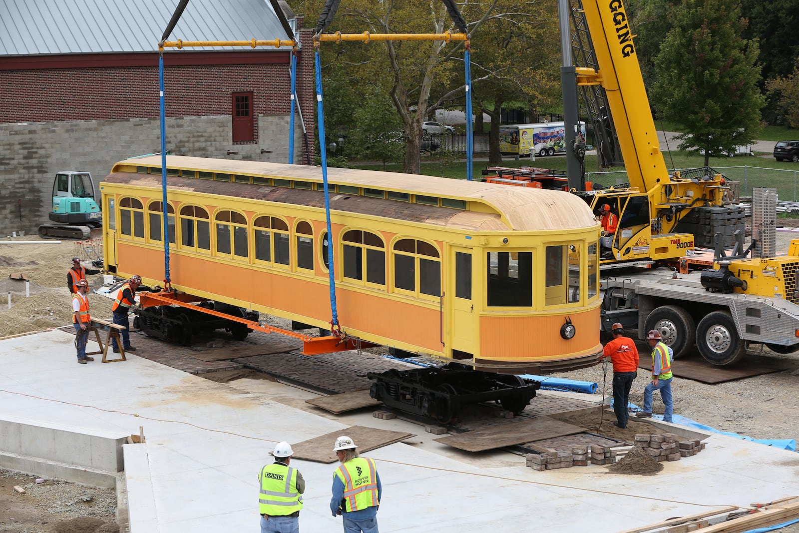 A fully restored 1903 interurban car, one of the gems of Carillon Parksâ new building expansion, was moved into its new home by crane. LISA POWELL / STAFF