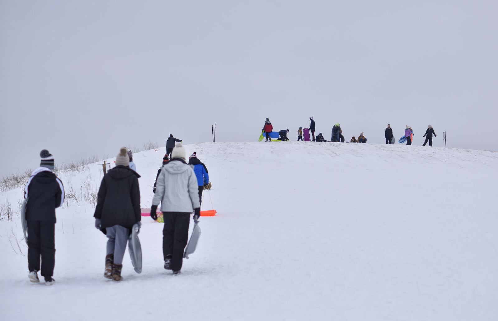 The sledding hill at Voice of America MetroPark was a popular attraction Thursday, February 18, 2021 in West Chester Township. Many schools in the area were off for a snow day. NICK GRAHAM / STAFF