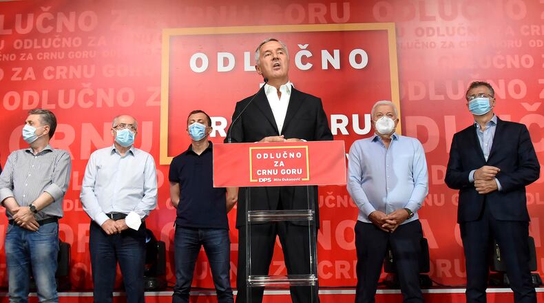 In this photo taken early Monday, Aug. 31, 2020, Montenegrin President Milo Djukanovic speaks at his party headquarters in Podgorica, Montenegro. The leaders of the three main opposition groups in Montenegro signed a coalition agreement Wednesday Sept. 9, 2020, to form the next government and sought to alleviate fears that they would steer the small Balkan state off its pro-Western course and back toward traditional allies Serbia and Russia. (AP Photo/Risto Bozovic)