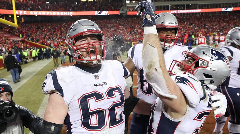 KANSAS CITY, MISSOURI - JANUARY 20:  Rex Burkhead #34 of the New England Patriots celebrates with nn62#2after scoring the game-winning touchdown to defeat the Kansas City Chiefs in overtime during the AFC Championship Game at Arrowhead Stadium on January 20, 2019 in Kansas City, Missouri. The Patriots defeated the Chiefs 37-31. (Photo by Patrick Smith/Getty Images)