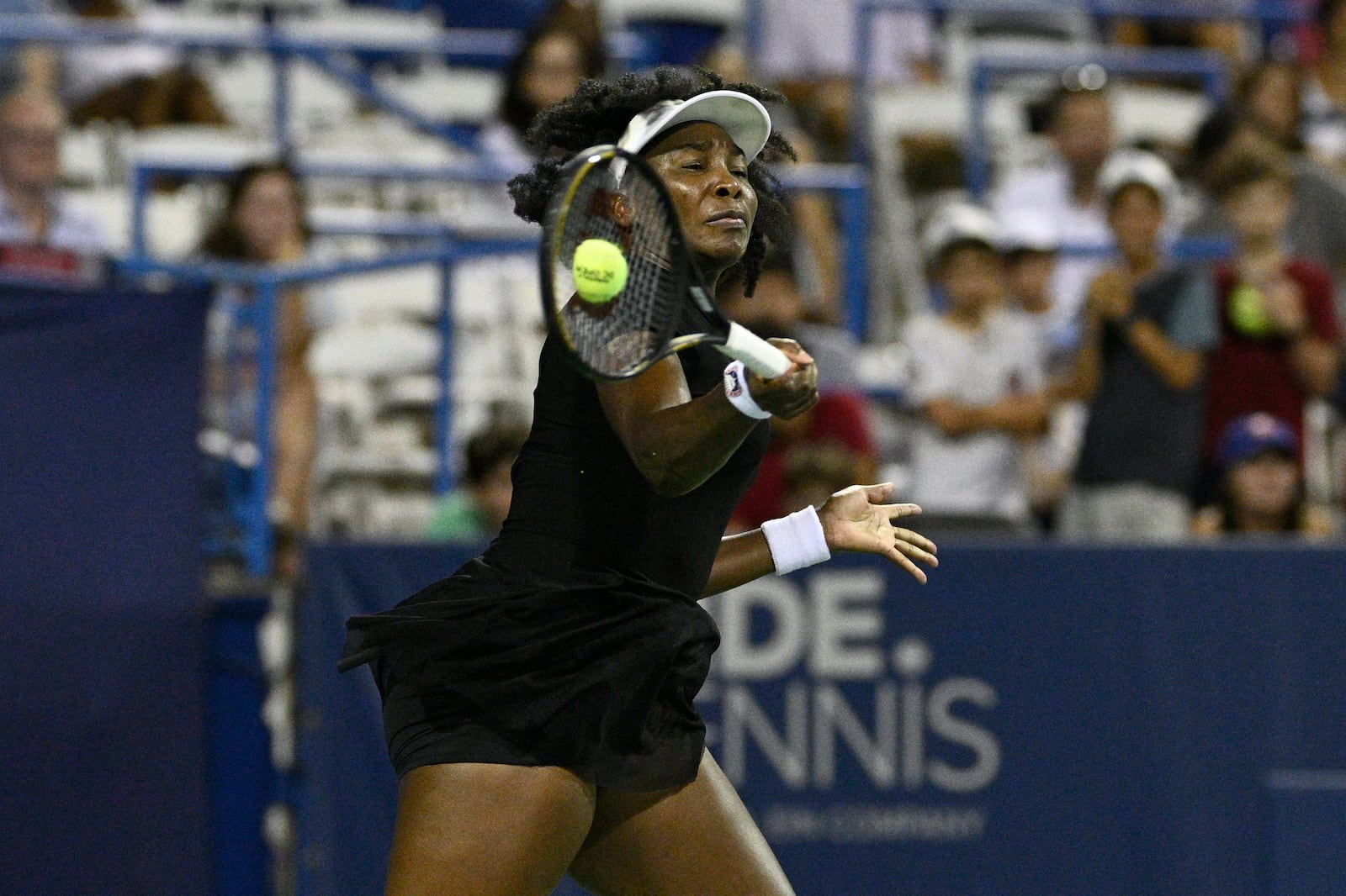 Venus Williams returns the ball against Magdalena Frech, of Poland, during a match at the Citi Open tennis tournament Thursday, July 24, 2025, in Washington. (AP Photo/Nick Wass)