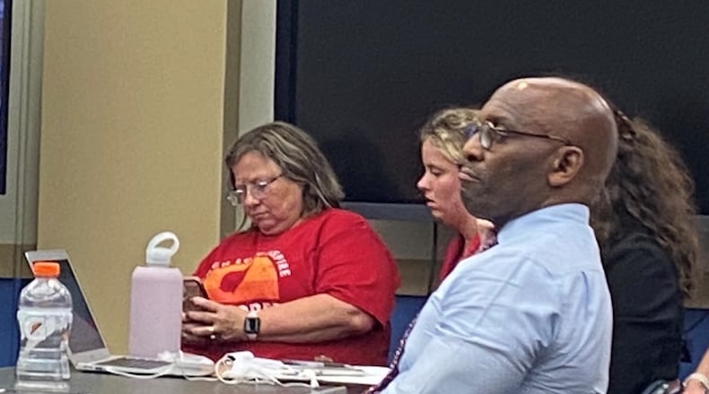 David Lawrence sits in the Dayton Public Schools meeting after the DPS board approves him as the new business manager for the district. Eileen McClory / staff