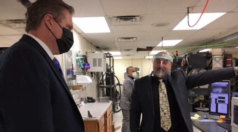 US Rep. Mike Turner, left, with Ayman Salem, chief executive of Material Resources LLC in Beavercreek. Turner toured MRL's labs at the Russ Research Center Tuesday. THOMAS GNAU/STAFF