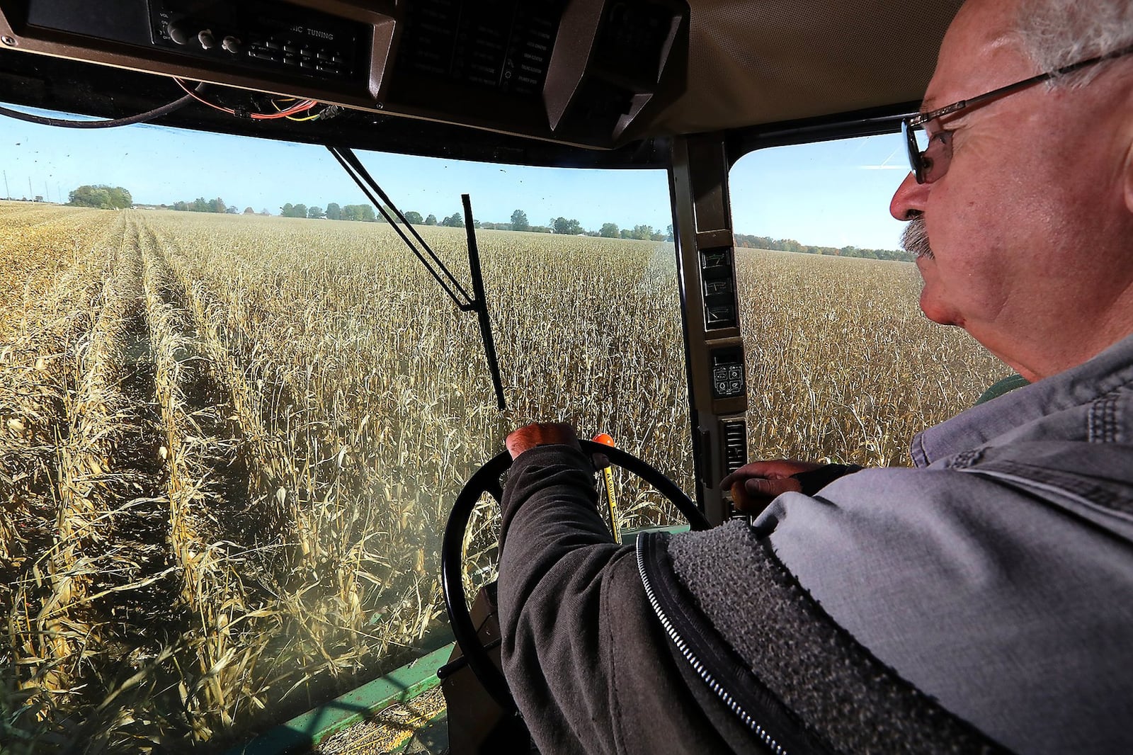 Bob Suver harvests his corn crop along Detrick-Jordan Pike near New Carlisle in 2020. BILL LACKEY/STAFF