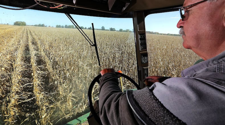 Bob Suver harvests his corn crop along Detrick-Jordan Pike near New Carlisle in 2019. BILL LACKEY/STAFF