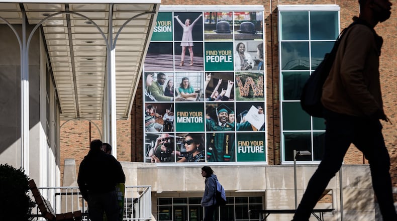 Wright State University students hustle to class Tuesday Oct. 26, 2021. JIM NOELKER/STAFF