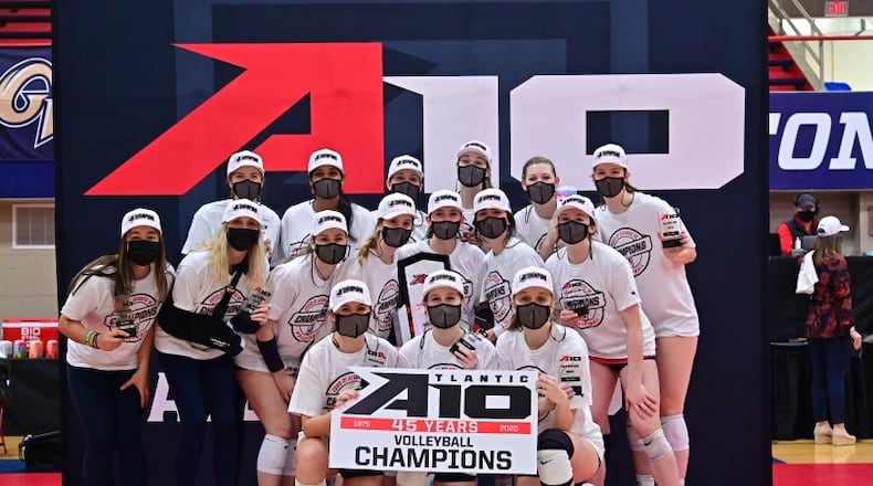 The Dayton Flyers celebrate after winning the Atlantic 10 Conference volleyball tournament championship on Saturday, April 3, 2021, at the Frericks Center. Photo by Erik Schelkun
