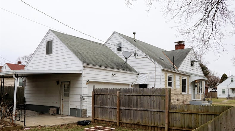 A door from the kitchen leads to the 2-car garage, which has a side service door that opens to the covered patio.