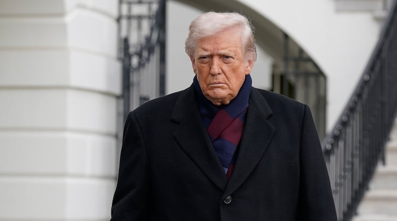 President Donald Trump talks to reporters as he departs from the South Lawn of the White House, Saturday, Dec. 13, 2025, in Washington, en route to Baltimore to attend the Army-Navy football game. (AP Photo/Jose Luis Magana)