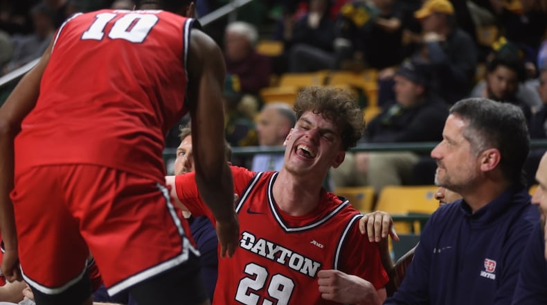 Dayton's Amaël L'Etang smiles during the final moments of a victory against George Mason on Wednesday, Feb. 18, 2026, at EagleBank Arena in Fairfax, Va. David Jablonski/Staff