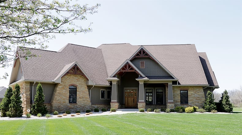 The 3-bedroom house offers about 4,090 sq. ft. of living space with a semi-finished lower level and a side-entry, 3-car garage. The home is on 1.27 acres with an in-ground pool and stone fire pit. CONTRIBUTED PHOTO BY KATHY TYLER