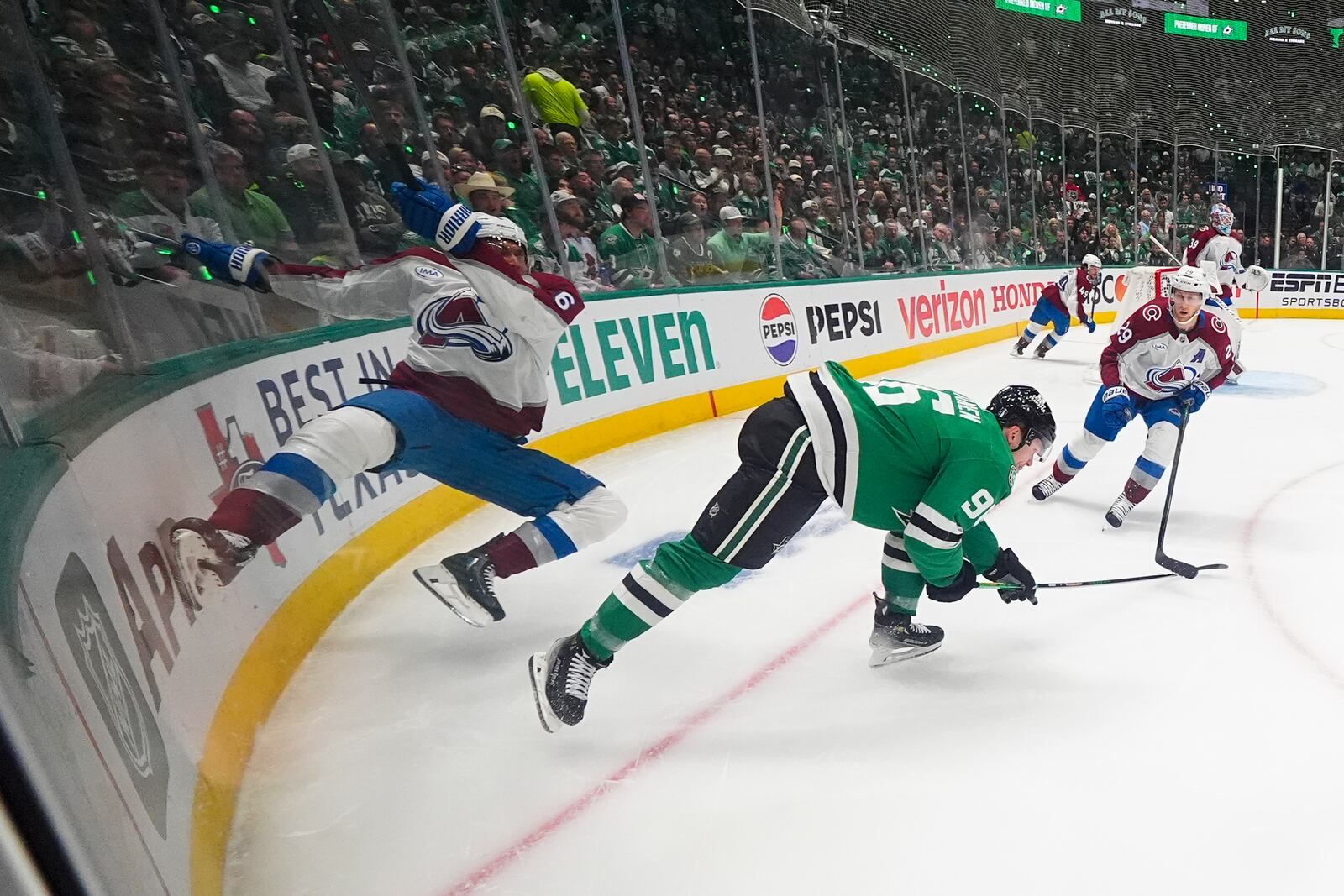 Colorado Avalanche defenseman Erik Johnson, left, and Dallas Stars right wing Mikko Rantanen (96) collide while competing for the puck during the first period in Game 2 of a first-round NHL hockey playoff series Monday, April 21, 2025, in Dallas. (AP Photo/Julio Cortez)