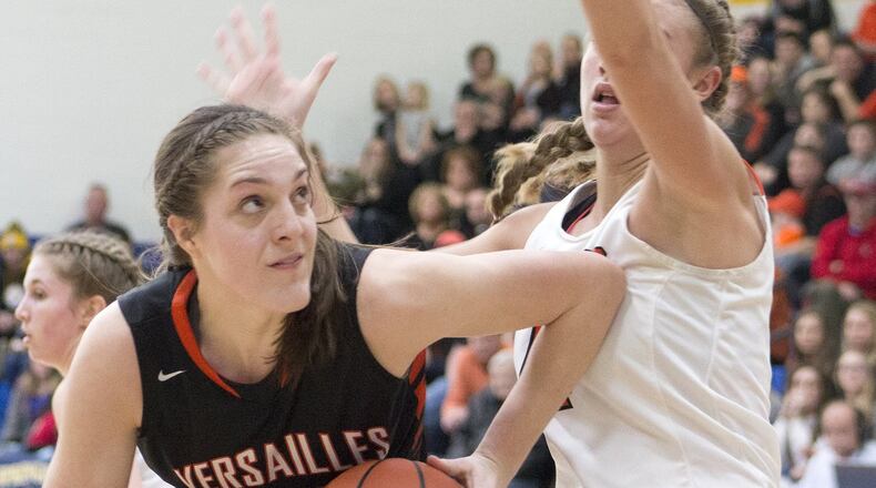 Versailles’ Danielle Winner looks to score against Waynesville’s Marcella Sizer during Saturday’s Division III regional final. Winner scored 11 points and Versailles won 59-28. JEFF GILBERT / CONTRIBUTED