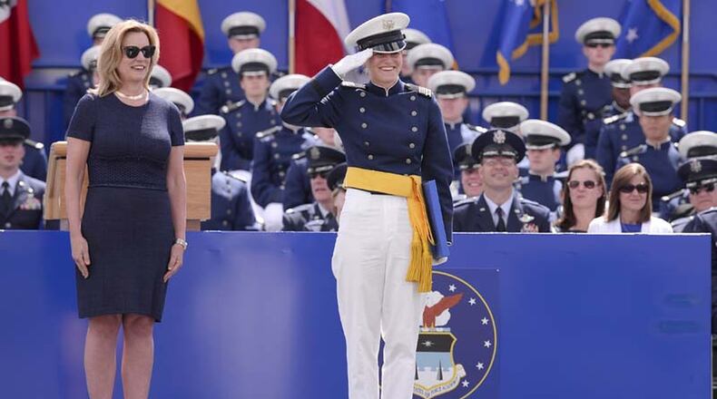 Alter High grad Rebecca Esselstein salutes her Air Force Academy class during the graduation ceremony on May 28, 2015. The woman (left) on stage with her is Deborah James, who was the secretary of the Air Force at that time. CONTRIBUTED