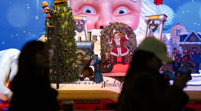 Black Friday Shoppers queue to enter Macy's flagship store in New York on Friday, Nov. 28, 2025. (AP Photo/Angelina Katsanis)