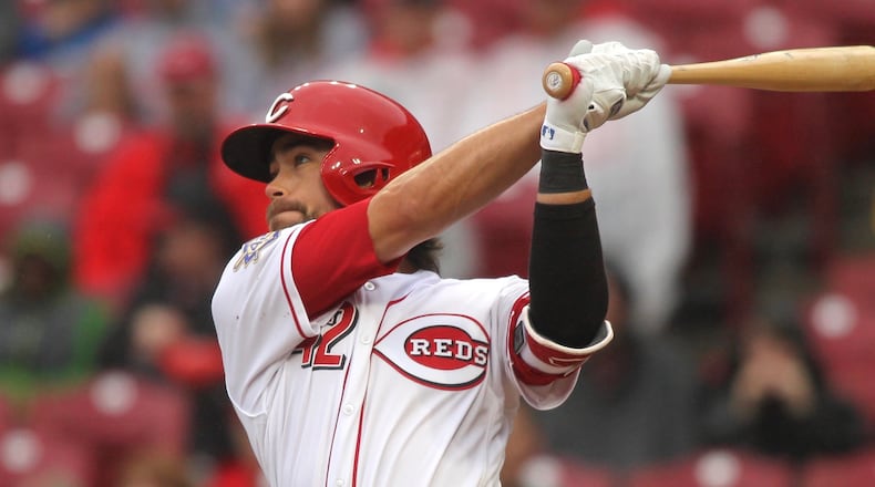The Reds Alex Blandino swings against the Cardinals on Sunday, April 15, 2018, at Great American Ball Park in Cincinnati. David Jablonski/Staff