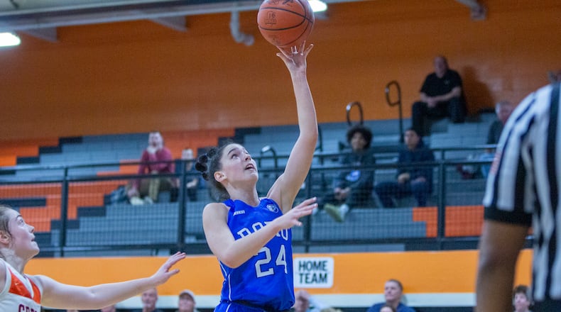 Springboro's Chloe Downing scores in the second half of Friday night's 48-29 victory at Beavercreek. CONTRIBUTED/Jeff Gilbert