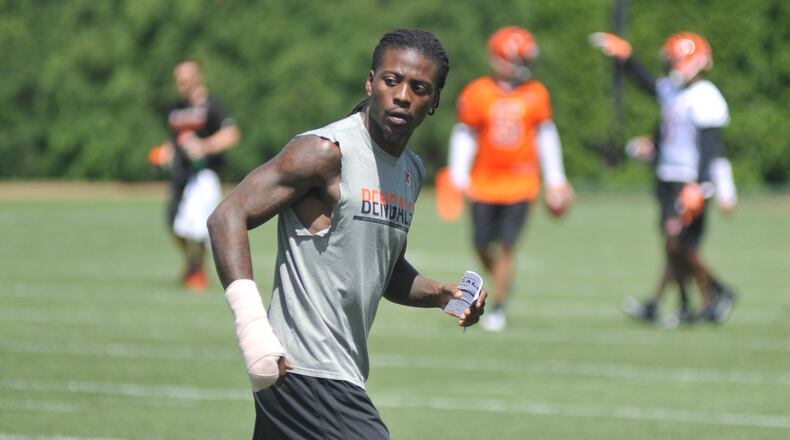 Cincinnati Bengals cornerback Dre Kirkpatrick, who recently fractured his right hand, runs through some mental reps during the team’s first OTA practice Tuesday. JAY MORRISON/STAFF