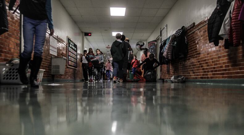 The Troy school district is working in 2025 on construction plans for four new schools, to replace seven older ones, including the more than 100-year-old Van Cleve school on East Main Street in Troy. JIM NOELKER/STAFF