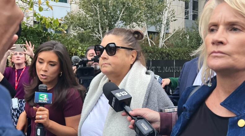 Dana Williamson, a former top aide to Gov. Gavin Newsom, center, leaves the courthouse Wednesday, Nov. 12, 2025, in Sacramento, Calif., after being indicted on federal charges alleging her involvement in a scheme to steal campaign money from former federal Health Secretary Xavier Becerra. (AP Photo/Sophie Austin)