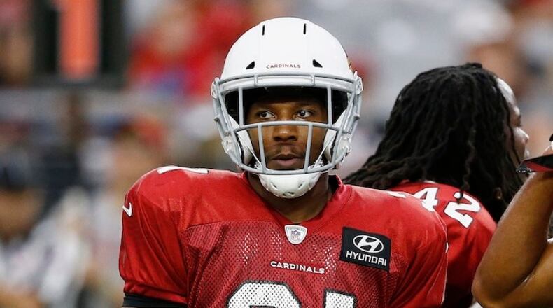 Arizona Cardinals running back David Johnson pauses after a play during an NFL football training camp Monday, July 24, 2017, in Glendale, Ariz. (AP Photo/Ross D. Franklin)