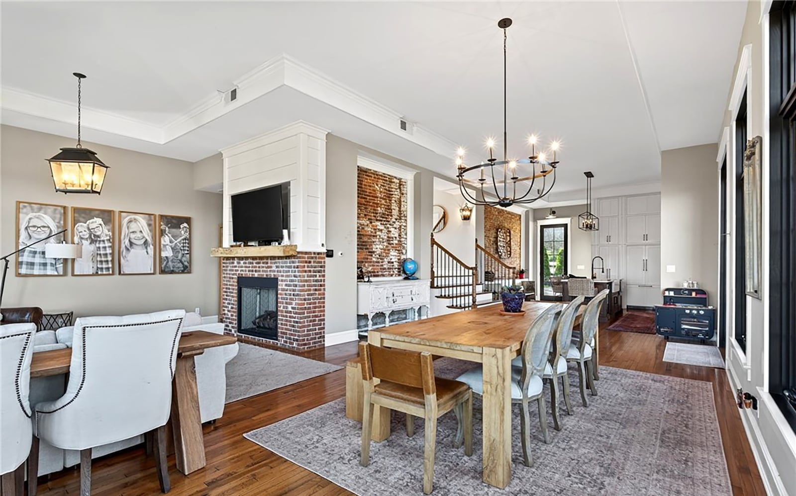 The open concept kitchen, dining room and living room have hardwood floors throughout. The updated kitchen has high end appliances including a gas range and there is a gas fireplace in the living room. CONTRIBUTED