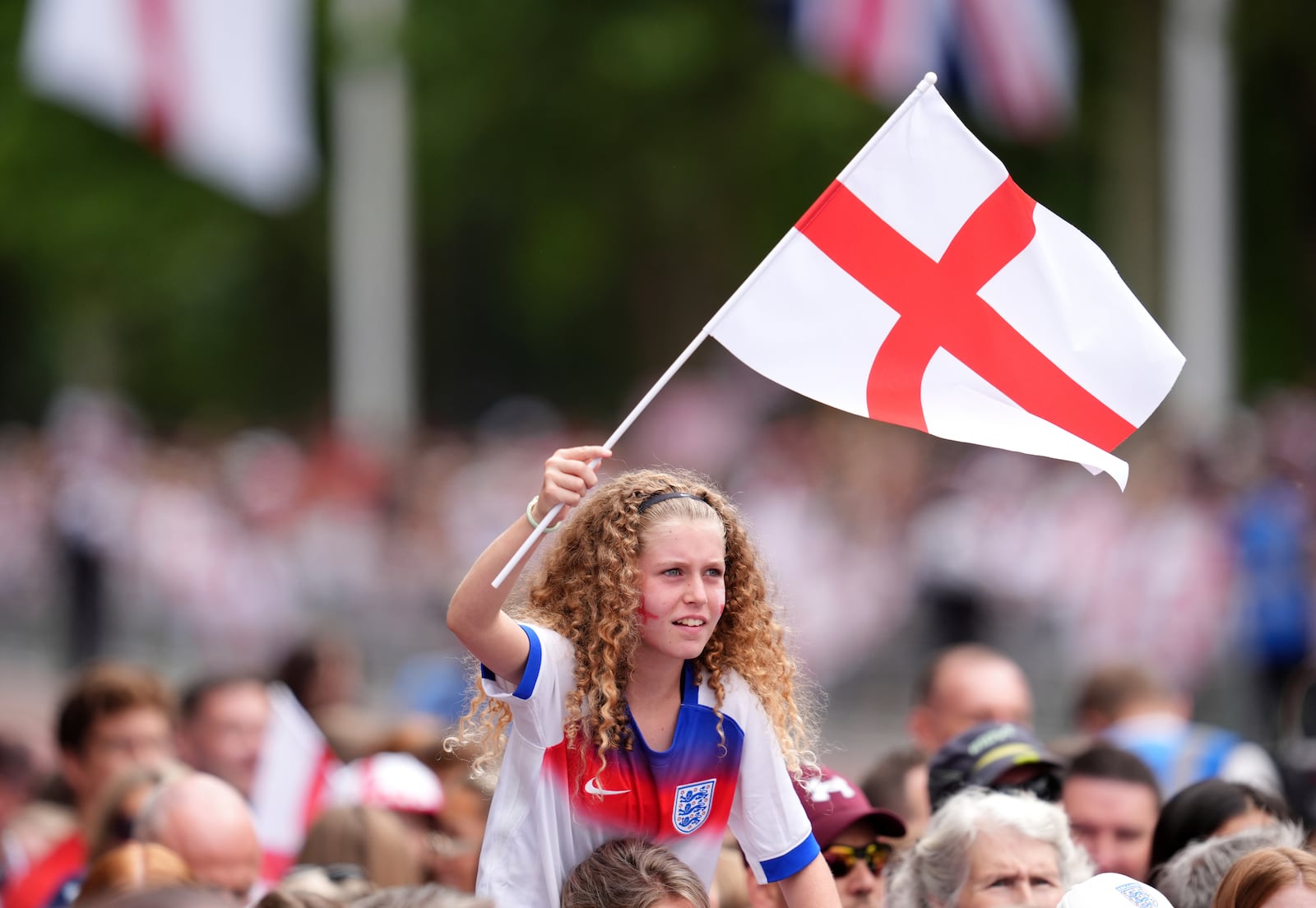 England fans ahead of a Homecoming Victory Parade on the Mall, London, Tuesday July 29, 2025, two days after England defended their European Championship crown as they beat Spain on penalties in the final of Euro 2025. (Adam Davy/PA via AP, Pool)
