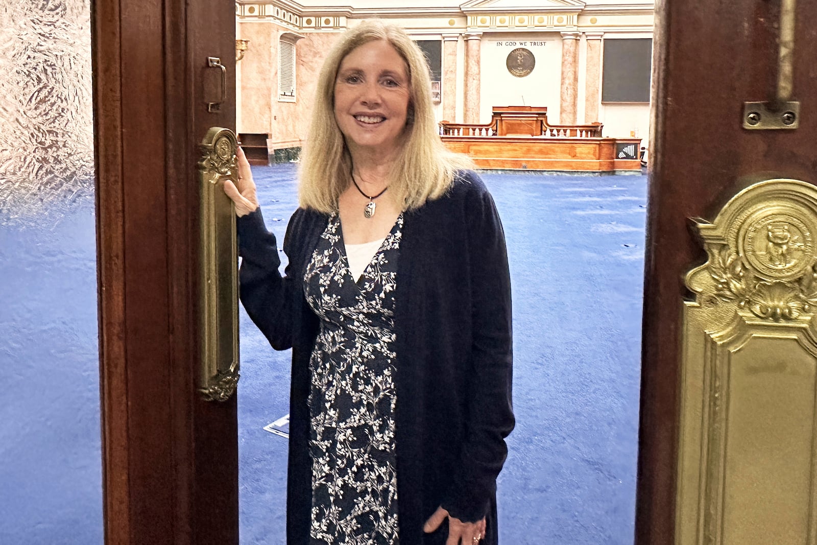 State Rep. Lisa Willner, D-Ky., stands at the door of the chamber for the Kentucky House of Representatives in Frankfort, Ky., on Monday, July 7, 2025. (AP Photo/Dylan Lovan)