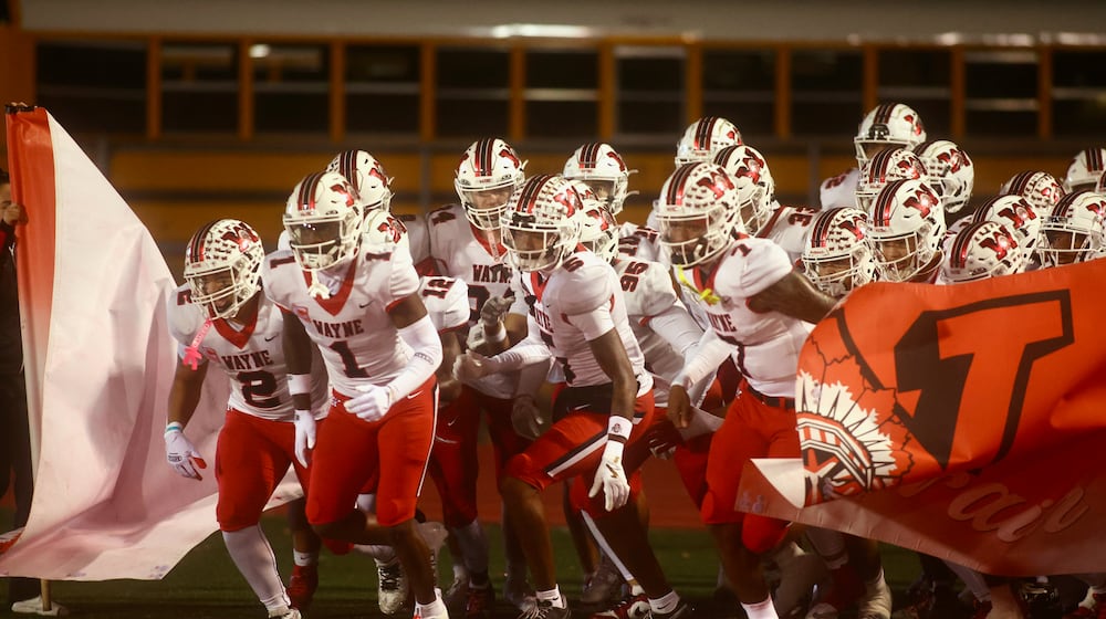 Wayne takes the field for a game against Troy in a Division I, Region 2 semifinal on Friday, Nov. 14, 2025, at Troy Memorial Stadium. David Jablonski/Staff