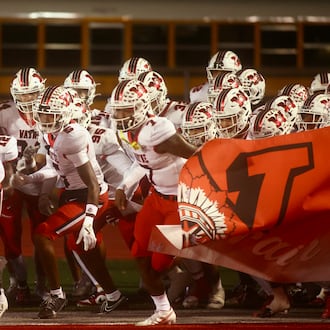 Wayne takes the field for a game against Troy in a Division I, Region 2 semifinal on Friday, Nov. 14, 2025, at Troy Memorial Stadium. David Jablonski/Staff