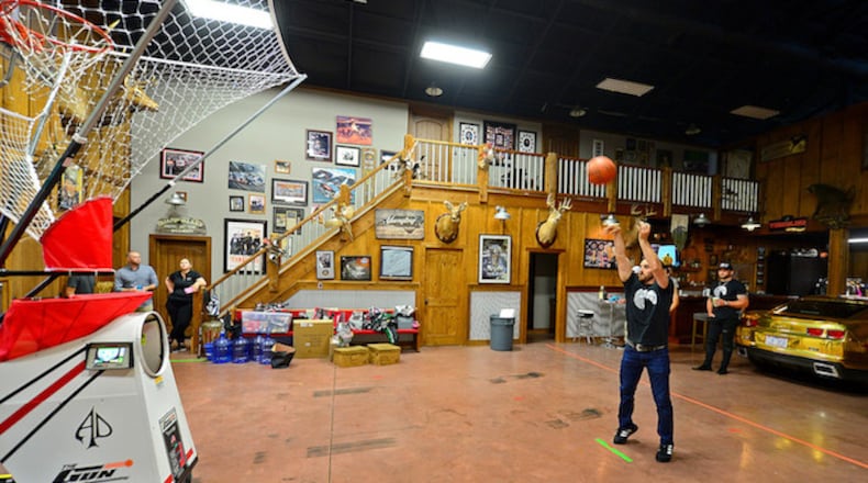 NASCAR Cup Series driver Austin Dillon practices shooting baskets in his home. Dillon lives in a barn where he lives with his wife, Whitney and entertains his friends along with broadcasting his podcast Barn Life. (Jeff Siner/Charlotte Observer/TNS)