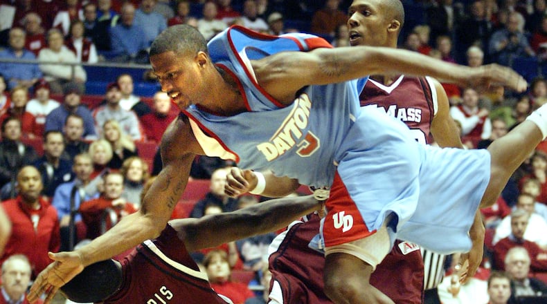 Dayton's Andres Sandoval (3) loses control of the ball on a move to the basket between UMass' Ricky Harris (5) and Dante Milligan during the first half of their Wednesday game on Jan. 17, 2008, at UD Arena. Staff photo by Chris Stewart