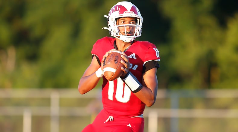 Trotwood-Madison High School quarterback Timothy Carpenter drops back to pass during their game against Alter on Thursday night in Trotwood. The Rams trailed by 10 points in the fourth quarter, but rallied to win 26-24. CONTRIBUTED PHOTO BY MICHAEL COOPER