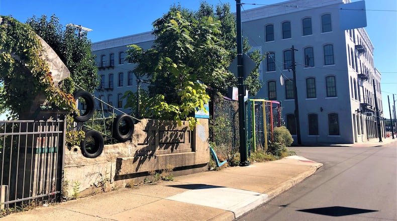 Developer Weyland Ventures plans to build 153 new apartments on the former Garden Station site at Wayne Avenue and East Fourth Street. The vacant property is across the street from the firm’s Wheelhouse Lofts apartments. CORNELIUS FROLIK / STAFF
