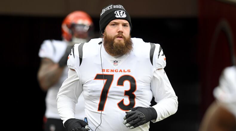 FILE - Cincinnati Bengals offensive tackle Jonah Williams (73) runs onto the field in the second half of an NFL football game against the Cleveland Browns, Sunday, Jan. 9, 2022, in Cleveland. The Cincinnati Bengals retooled their porous offensive line after watching Joe Burrow get sacked an astounding 70 times in 20 games last season, including seven times in their losing effort in the Super Bowl. One of the bright spots in that mess was left tackle Jonah Williams, who was graded out by Pro Football Focus as the Bengals' best lineman last season. (AP Photo/Nick Cammett, File)