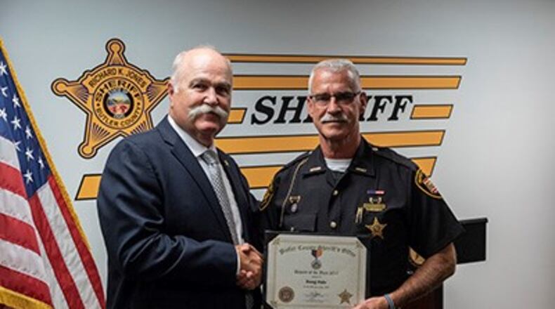 Butler County Sheriff Jones congratulates Deputy Doug Hale, who was recently named Deputy of the Year.