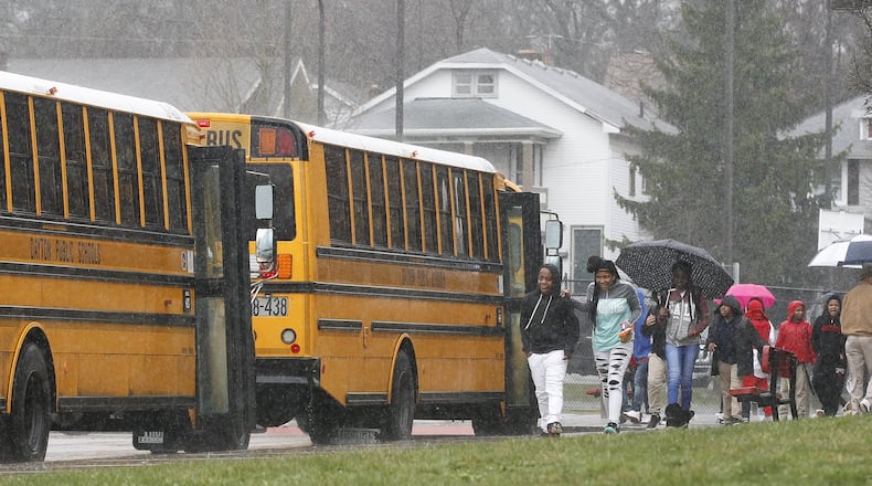 Students board buses Thursday at Edwin Joel Brown Middle School in Dayton. Dayton Public Schools bus drivers have filed a strike notice that would take effect April 10. CHRIS STEWART / STAFF