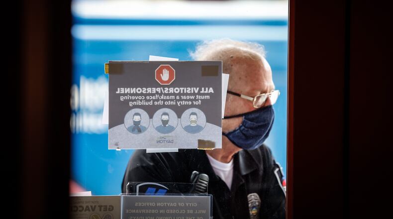 During much of the pandemic, the city of Dayton required people who entered city-owned buildings to wear a mask because of COVID-19. JIM NOELKER/STAFF