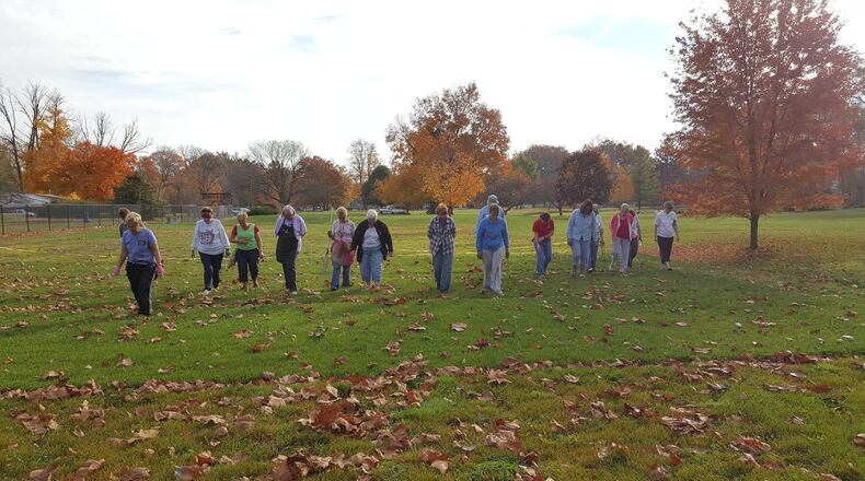 Master Gardener volunteers walking the OSU Turf research plots inspecting quality. CONTRIBUTED
