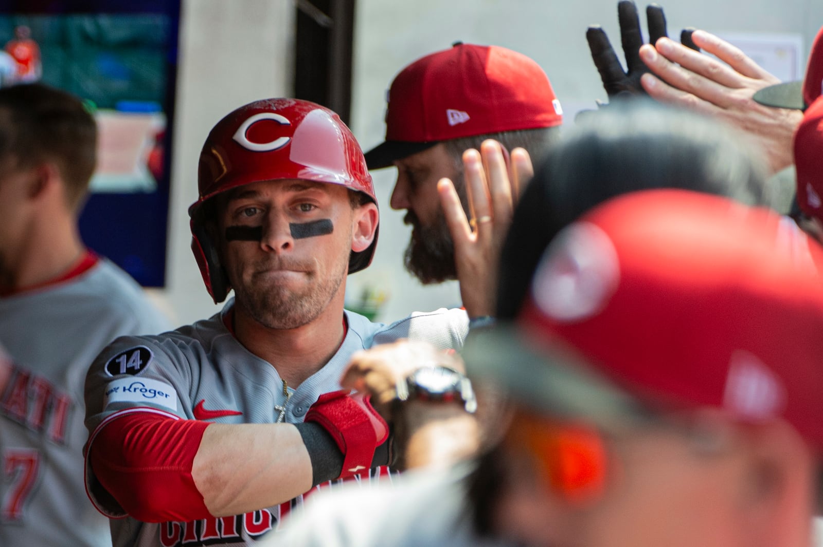 Cincinnati Reds' TJ Friedl is congratulated by his teammates after hitting a solo home run off Cleveland Guardians starting pitcher Logan Allen during the fourth inning of a baseball game, Wednesday, June 11, 2025, in Cleveland. (AP Photo/Phil Long)