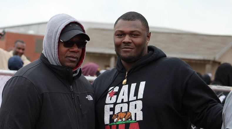 Former Ohio State and University of Kentucky lineman Marcelys Jones (right) stands with his uncle, Anthony Ross, a former Central State linebacker from the 1980s, during CSU’s spring football game Saturday. The 6-foot-4, 320-pound Jones is considering transferring to CSU and playing for the Marauders this season. CONTRIBUTED PHOTO