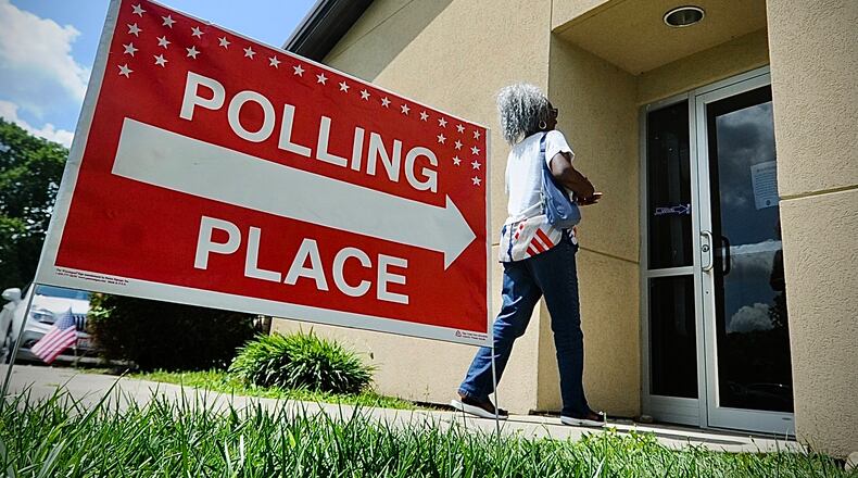 A voter walks into her polling location at the St. Luke Missionary Baptist Church on Gettysburg Ave. Tuesday Aug. 8, 2023. MARSHALL GORBY\STAFF