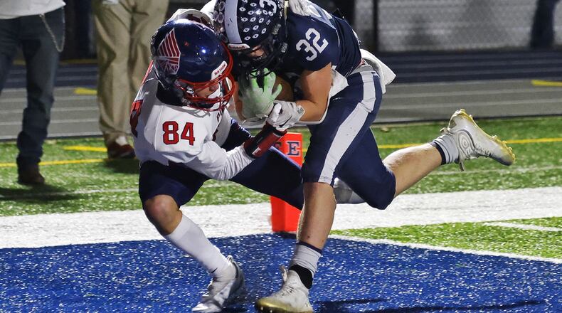 Edgewood's Braden Sullivan (32) intercepts a pass intended Piqua's Ryan Brown (84) to win the game in overtime of their playoff football game Friday, Nov. 4, 2022 at Edgewood's Kumler Field. Edgewood won 21-14. NICK GRAHAM/STAFF
